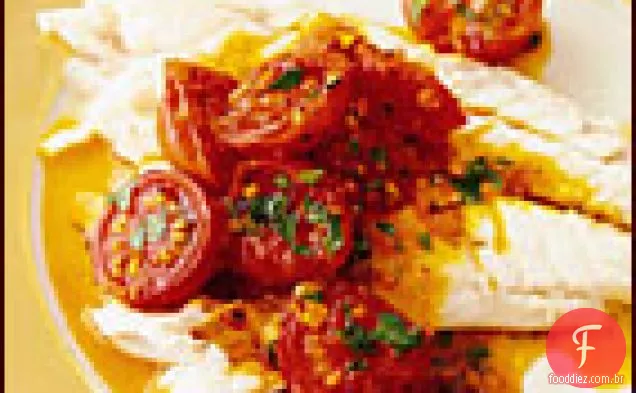 Robalo assado com sal com vinagrete de tomate quente