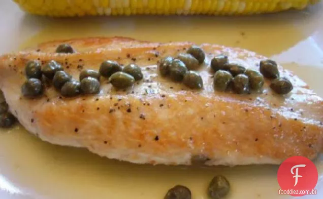 Costeletas de peru com molho cítrico e alcaparras