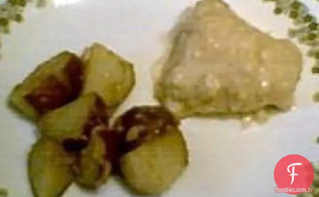 Frango assado picante e batatas