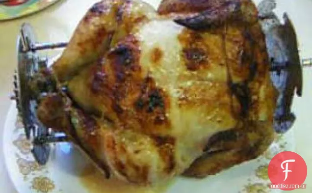 Frango do tio Bill assado em um Rotissiere