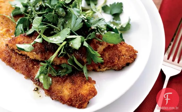 Costeletas de vitela fritas com salada de ervas