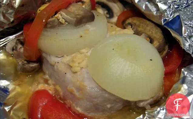 Costeleta De Porco Com Molho De Cogumelos
