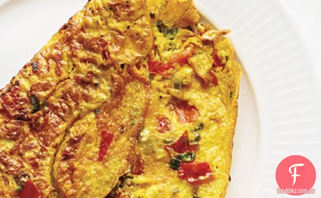 Omelete com açafrão, tomate e cebola