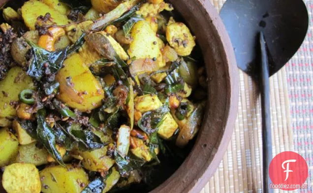 Frango frite com batata, castanha de caju e folhas de Curry