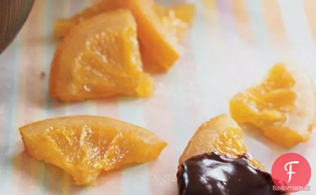 Fatias de laranja cristalizadas com molho de Ganache