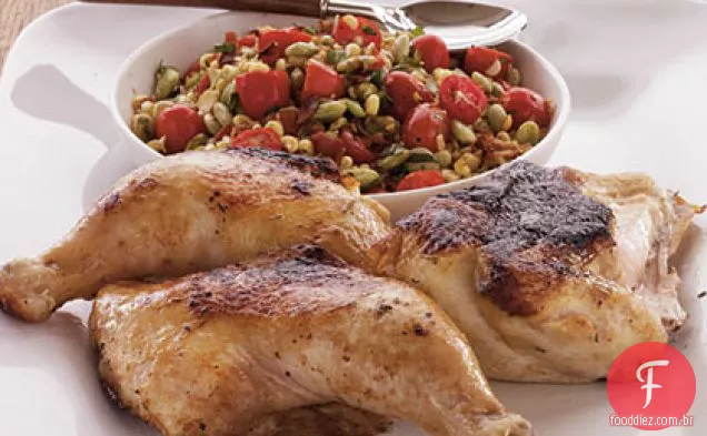 Frango sob um tijolo