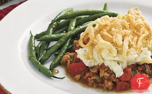 Caçarola de salsicha e purê de batata com Topo de cebola