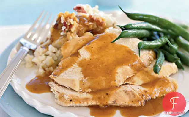 Frango assado com batatas novas esmagadas e Jus Garlicky