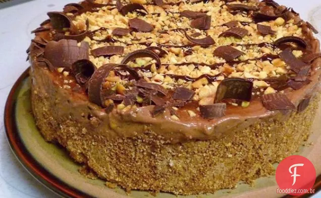 Torta Vegan Da Mousse Do Redemoinho Da Manteiga De Amendoim Do Chocolate Com Molho Do Agave Da Manteiga De Amendoim Do Chocolate