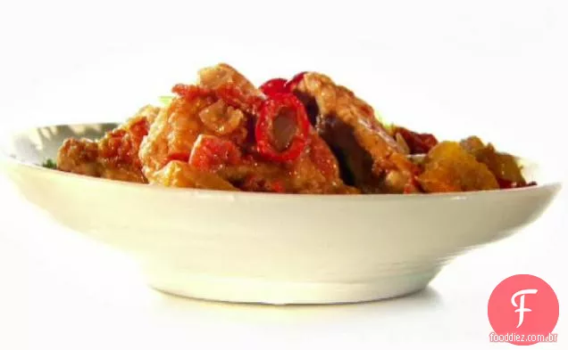 Guisado de oito especiarias e coxas de frango com arroz de lentilha