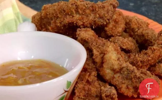 Tiras de carne laranja com molho de laranja