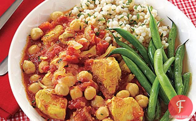 Frango com curry e guisado de grão de bico