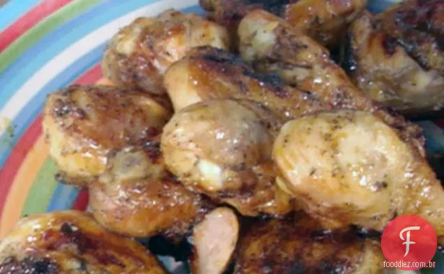 Tangerina-coxas de frango envidraçadas com bordo e baquetas