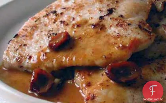 Costeletas de Peru salteadas com molho de laranja e Cranberry