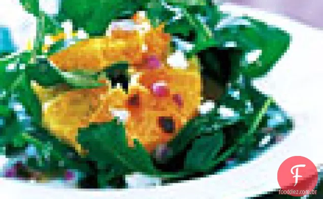 Salada de rúcula com, laranjas, sementes de romã e queijo de cabra